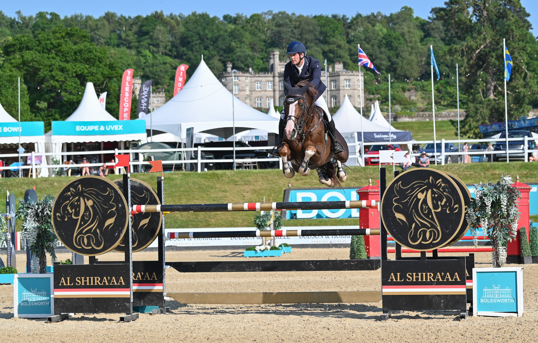 Billy Twomey and CHAT BOTTE ED on their way to victory in the Grand Prix at Bolesworth 2023